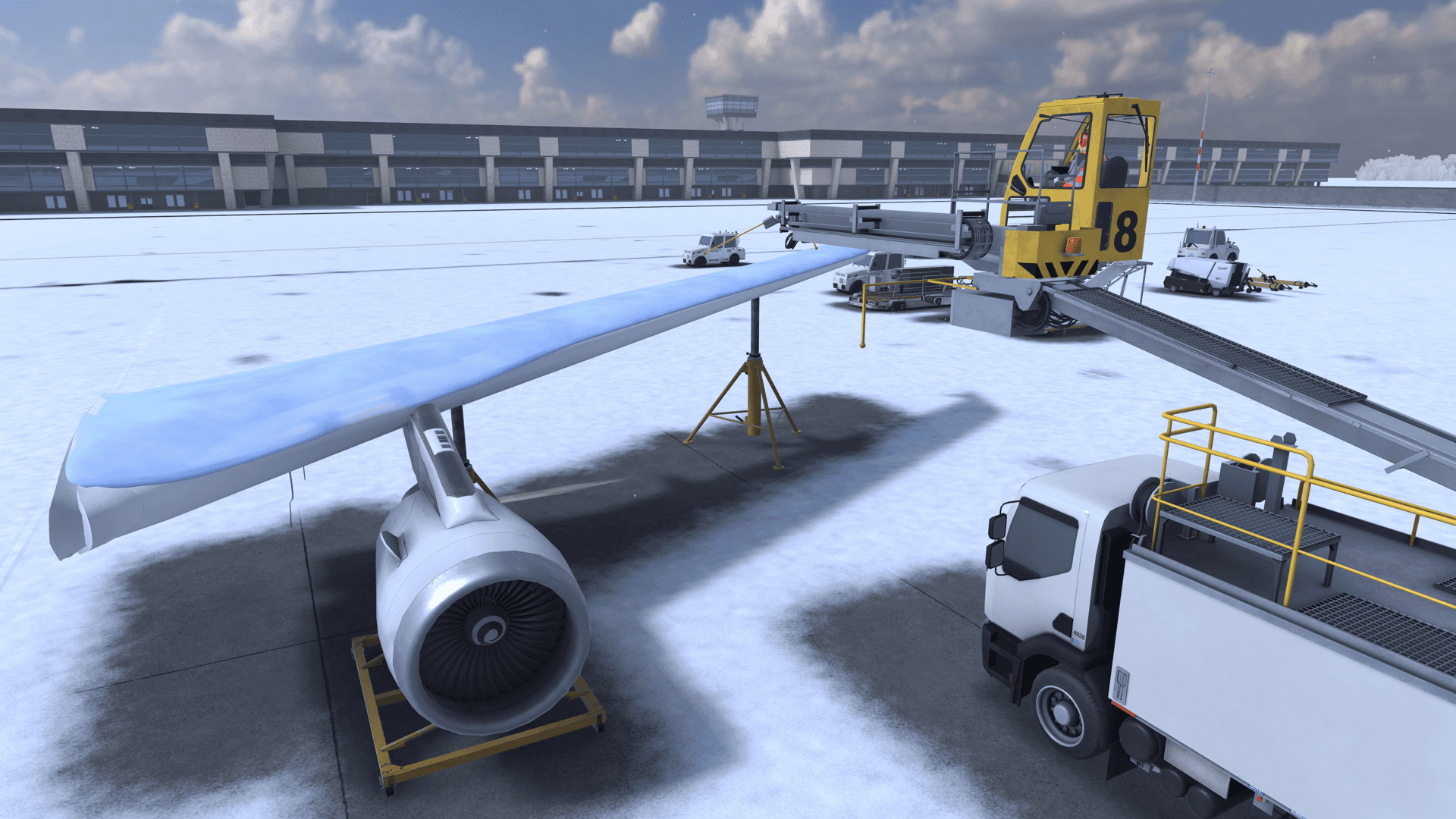 Practice wing on a stand next to the de-icing truck